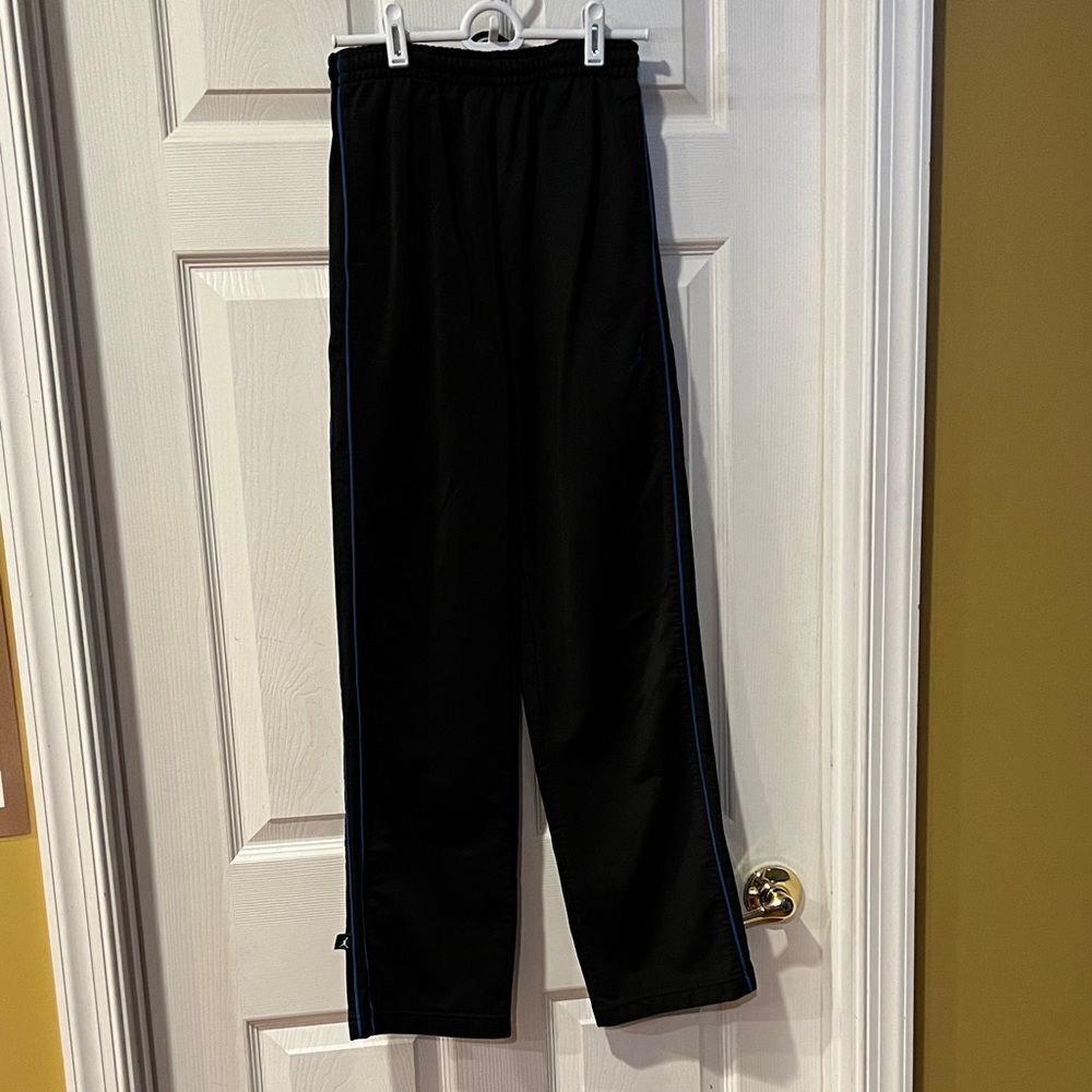 Air Jordan black with blue strip youth boys size large athletic pants.